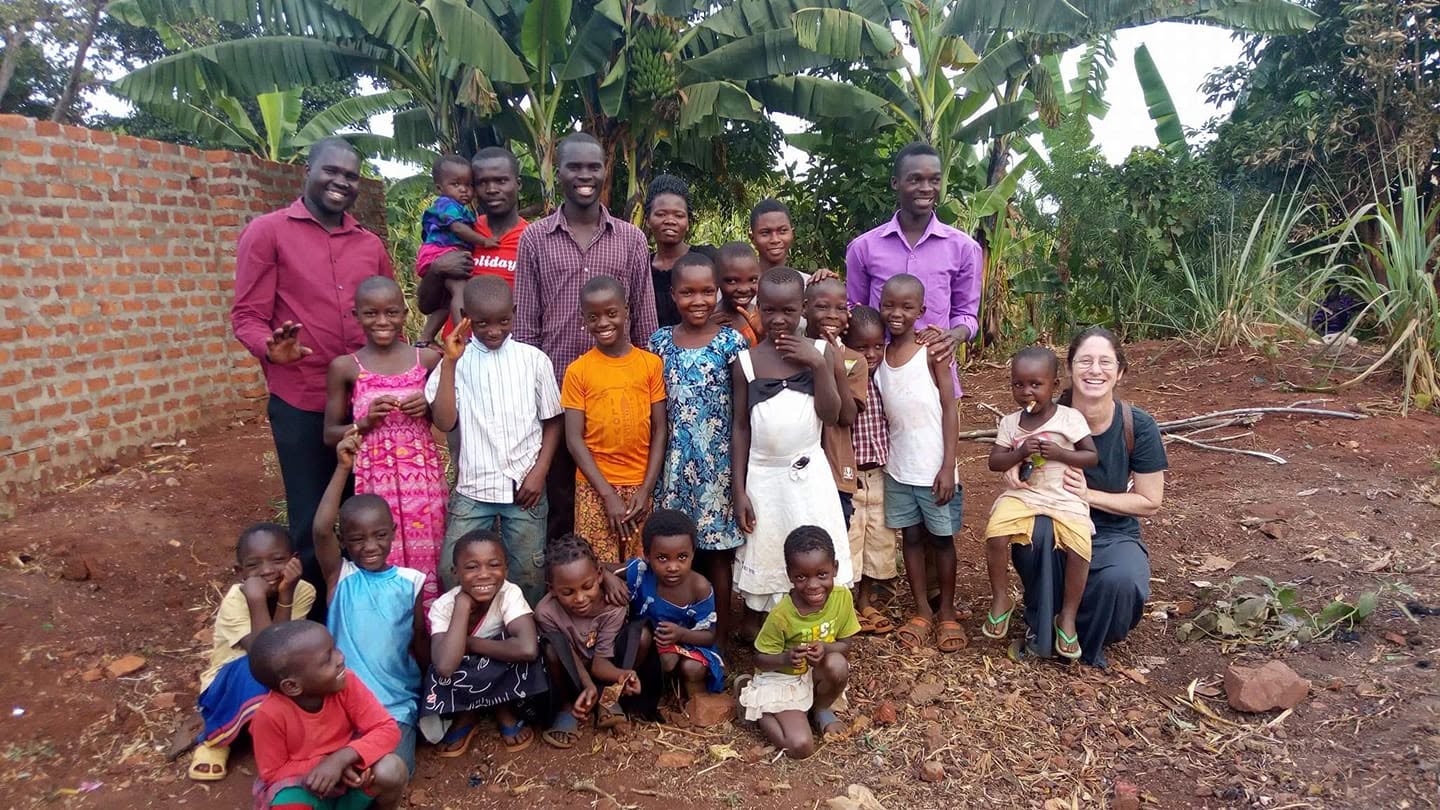A volunteer spending time with a child in the program